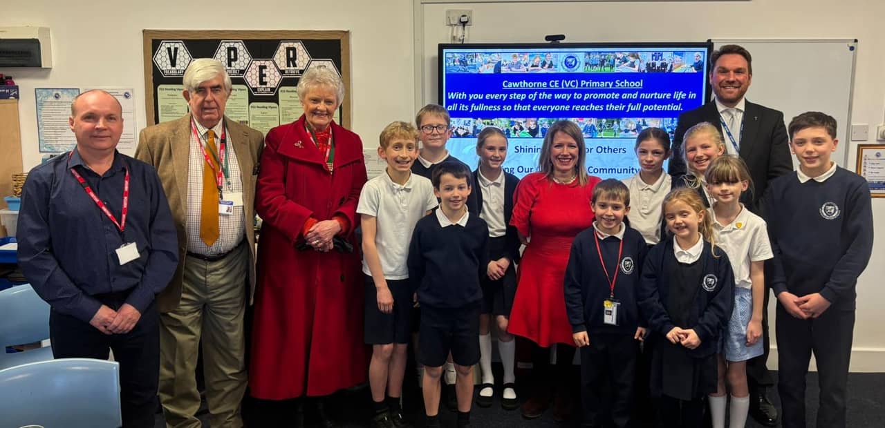 Local school children tell MP about road safety awareness campaign