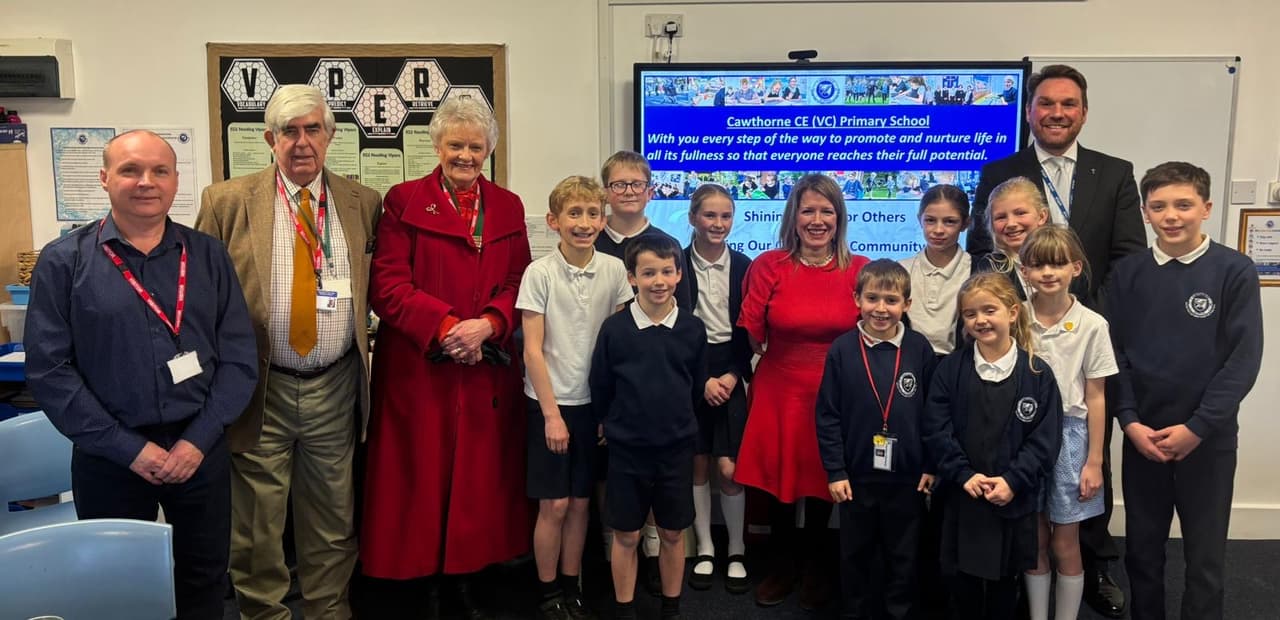 Local school children tell MP about road safety awareness campaign